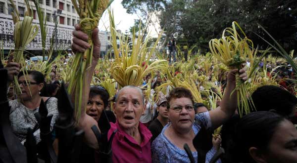 Catholics Attend Palm Sunday Service Outside Cathedral in Honduras