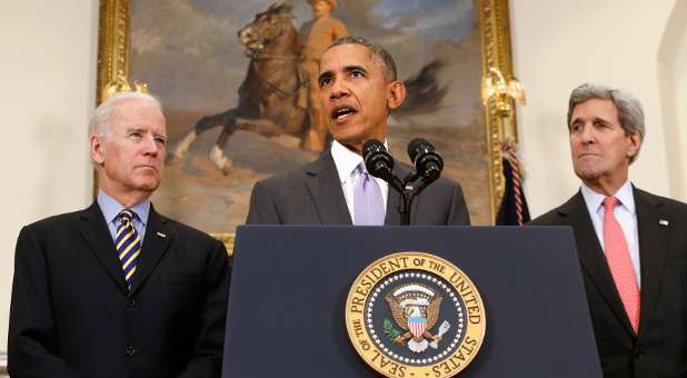 U.S. President Barack Obama is flanked by Vice President Joe Biden (L) and Secretary of State John Kerry (R) as he delivers a statement on legislation sent to Congress to authorize the use of military force against the Islamic State.