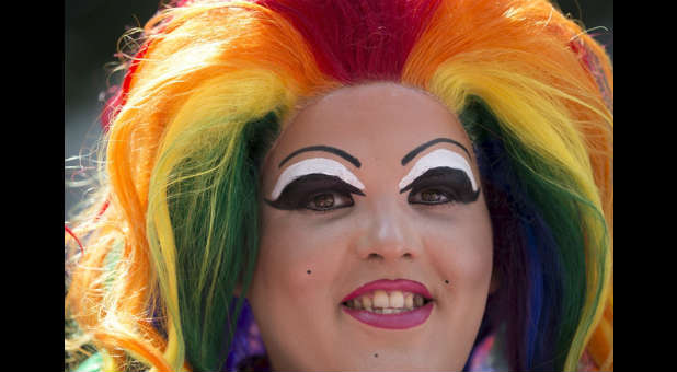 An LGBT person at a gay pride event in England.