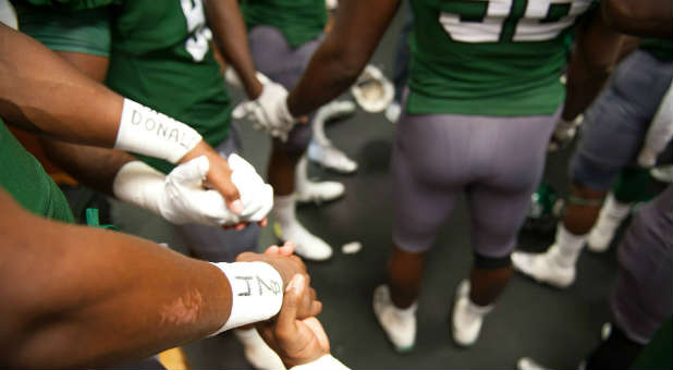 Delta State University football players. A pastor was shot and killed on their campus.