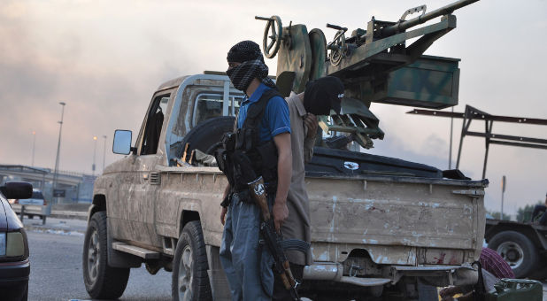 An ISIS fighter in Mosul. Jihadis expanded their threats to Christians in Europe.