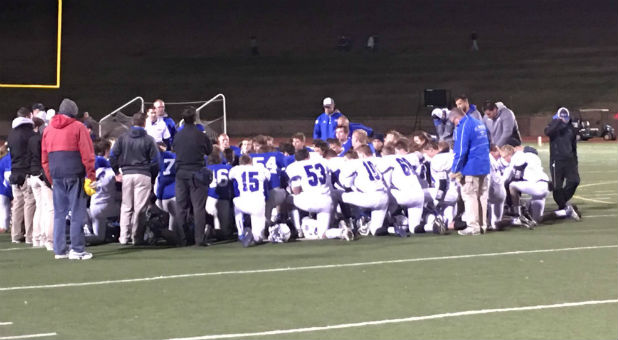 Prayer on the football field in North Dakota.