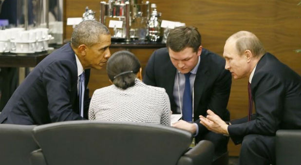 President Barack Obama (L) talks with Russian President Vladimir Putin (R) and U.S. security advisor Susan Rice (2nd L) prior to the opening session of the Group of 20 (G20) Leaders summit.