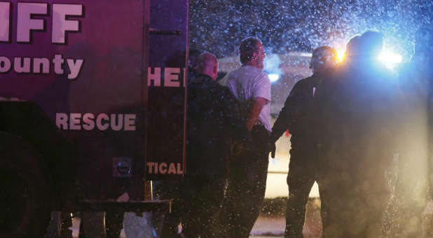 A suspect is taken into custody outside a Planned Parenthood center in Colorado Springs.