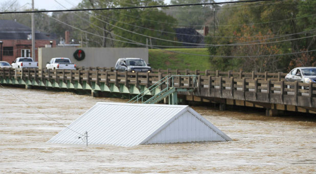 Floods and tornadoes kill at least 43 over Christmas.