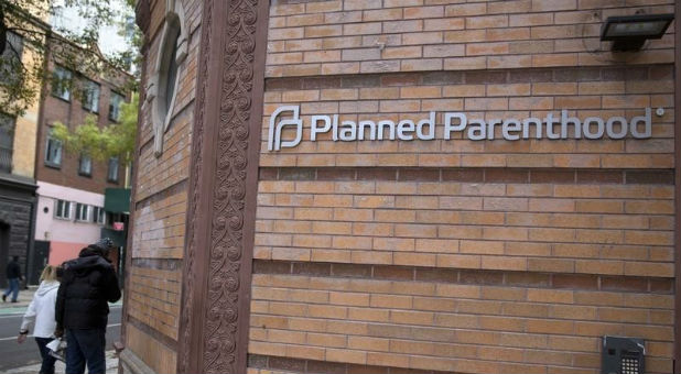 In a twist for the Texas Republican leaders who ordered an investigation and accused the women's health group of illegally trading in aborted fetal tissue, a grand jury cleared Planned Parenthood and indicted video makers David Daleiden and Sandra Merritt on Monday for tampering with a governmental record.