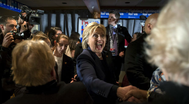 Hillary Clinton shakes hands with supporters.