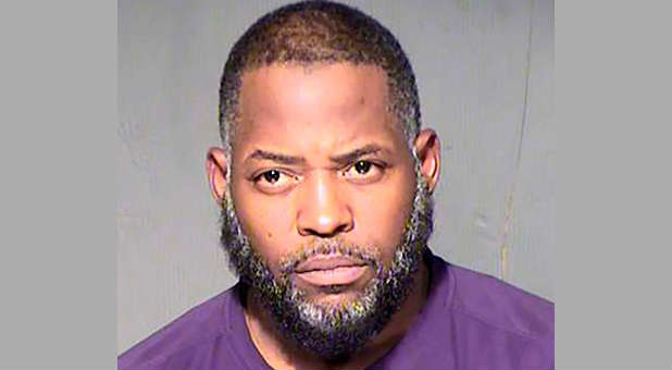 Abdul Malik Abdul Kareem, also known as Decarus Thomas, is seen in an undated booking photo released by the Maricopa County Sheriff's Office in Phoenix, Arizona.