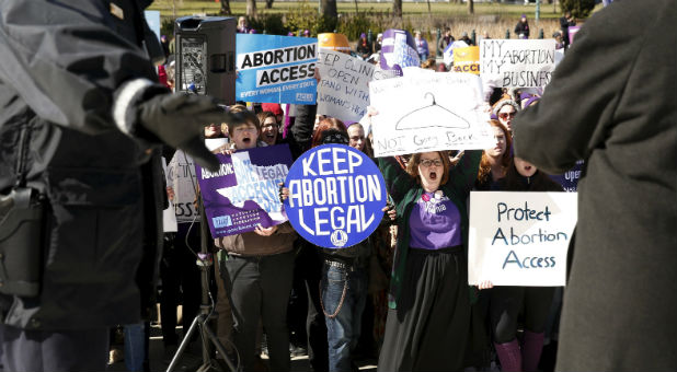 Abortion advocates rally outside the Supreme Court.