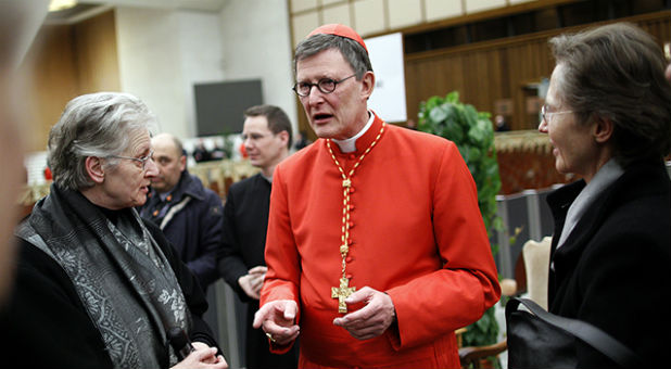 Cardinal Rainer Maria Woelki of Germany receives guests in the Paul VI Hall at the Vatican.