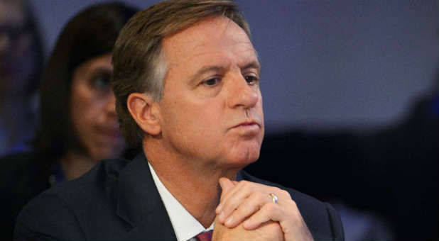 Tennessee Republican Governor Bill Haslam listens.