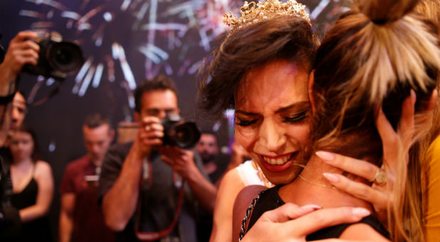 Taleen Abu Hanna, an Israeli Arab, reacts after winning the first-ever Miss Trans Israel beauty pageant.