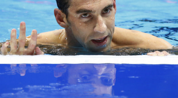 Michael Phelps (USA) of USA reacts after winning.