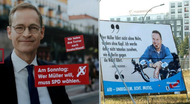 Election posters of top candidate of Social Democratic Party (SPD) and Mayor of Berlin Michael Mueller (L) and top candidate of the anti-immigration party Alternative for Germany (AfD) Georg Pazderski for the upcoming local city elections are pictured in Berlin, Germany.