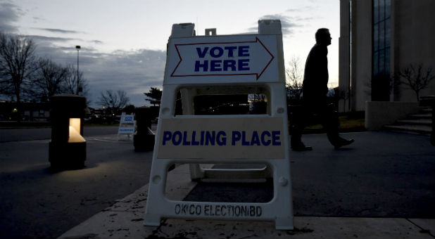 An early morning voter walks into St. Luke's United Methodist Church to cast their vote in Oklahoma City, Oklahoma