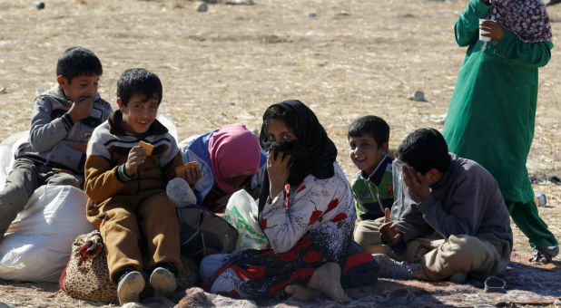 Displaced people from the outskirts of Mosul arrive in the town of Bashiqa, after it was recaptured from the Islamic State, east of Mosul, Iraq.