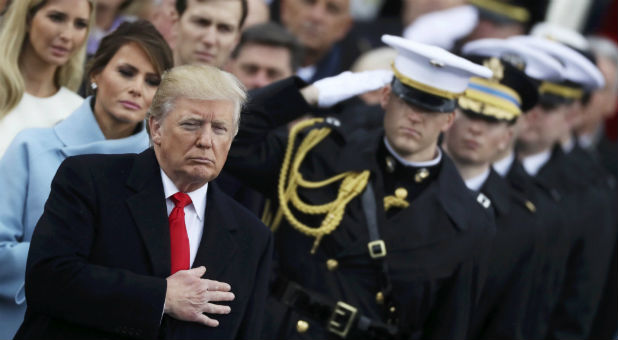 President Donald Trump listens to the national anthem after inauguration ceremonies swearing him in as the 45th president of the United States on the west front of the U.S. Capitol in Washingto