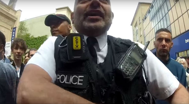 Police challenge a Christian preacher.