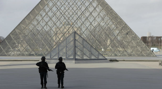 French police secure the site near the Louvre Pyramid in Paris, France, Feb. 3, 2017 after a French soldier shot and wounded a man armed with a knife after he tried to enter the Louvre museum in central Paris carrying a suitcase