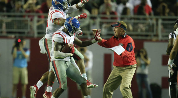 Mississippi Rebels head coach Hugh Freeze reacts with his defense