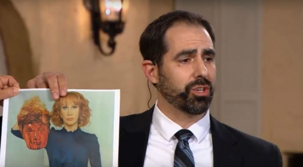 Joel Richardson holds up a photo of Kathy Griffin