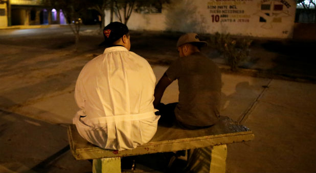 An aspiring Catholic priest Jose Luis Guerra, a member of Raza Nueva in Christ, a project of the archdiocese of Monterrey, talks to Angel Castillo, who wants to become a missionary with Raza Nueva, in the municipality of Garcia, outskirts of Monterrey, Mexico.