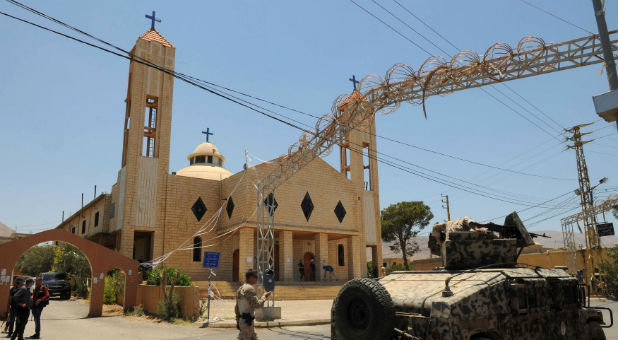 Lebanese army soldiers patrol near a church outside which suicide bombers blew themselves up in the Christian village of Qaa, in the Bekaa valley, Lebanon June 28, 2016.