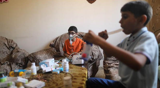 Palestinian Boys Receiving Oxygen Treatments for Cystic Fibrosis