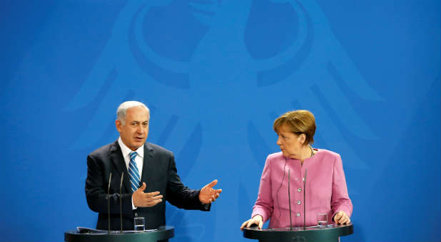 Israeli Prime Minister Benjamin Netanyahu and German Chancellor Angela Merkel address a news conference at the Chancellery in Berlin, Germany.