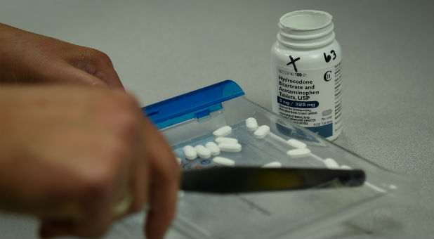 A pharmacist counts tablets of Hydrocodone at a pharmacy in Portsmouth, Ohio.