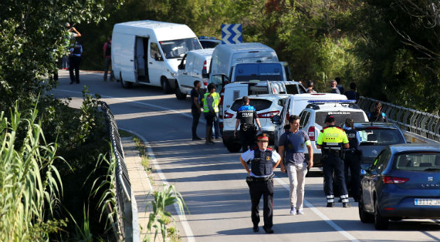 Catalan Mossos d'Escuadra vans are parked along a road near the place where Younes Abouyaaqoub, the man suspected of driving the van that killed 13 people in Barcelona last week, was killed by police in Sant Sadurni d'Noia, Spain, Aug. 21, 2017.
