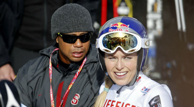 Lindsey Vonn of the United States (right) stands with boyfriend Tiger Woods after run one of the women's giant slalom in the FIS alpine skiing world championships at Raptor Racecourse.