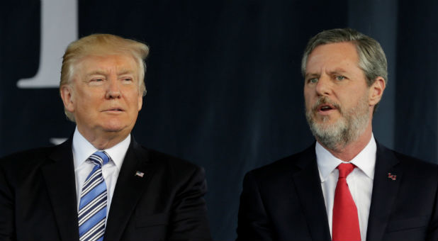 U.S. President Donald Trump (L) stands with Liberty University President Jerry Falwell Jr. after delivering keynote address at commencement in Lynchburg, Virginia.