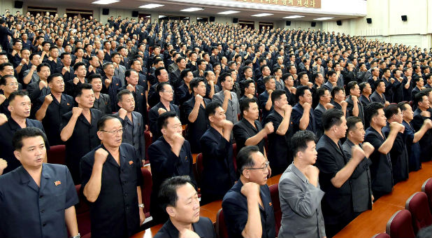 A meeting of DPRK of the central committee is held as they vow a sacred war against the U.S.