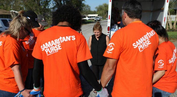 Volunteers for Samaritan's Purse pray while serving Harvey victims.