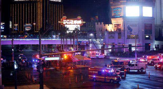 Las Vegas Metro Police and medical workers stage in the intersection of Tropicana Avenue and Las Vegas Boulevard South after a mass shooting at a music festival.