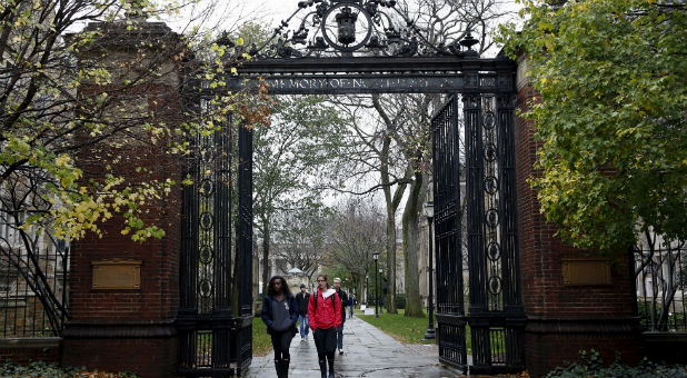 Students walk on the campus of Yale University in New Haven, Connecticut.