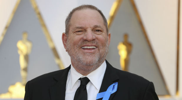 Harvey Weinstein poses on the Red Carpet after arriving at the 89th Academy Awards in Hollywood, California.