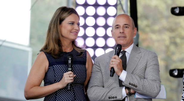 Hosts Savannah Guthrie (L) and Matt Lauer appear during NBC's