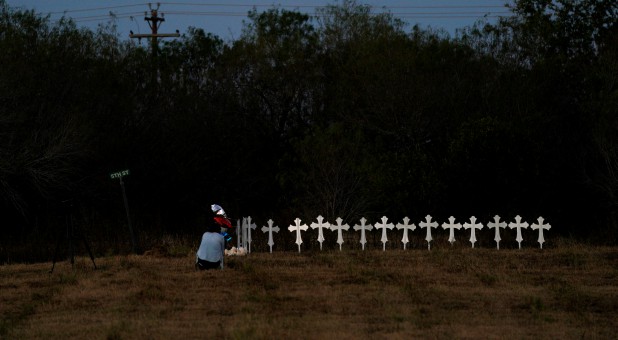Crosses are placed near a vigil in the memory of those killed in the shooting at the First Baptist Church of Sutherland Springs, Texas.