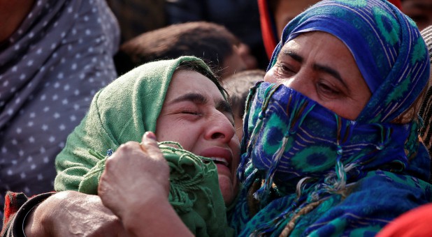 Women mourn in India.