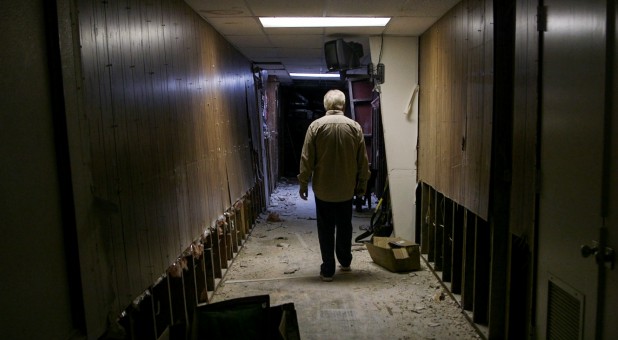 A man evaluates damage at a Houston-area church.