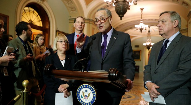 U.S. Senate Minority Leader Chuck Schumer (D-NY) (2nd L), flanked by Senator Patty Murray (D-WA) (from L), Senator Ron Wyden (D-OR) and Senator Dick Durbin (D-IL) (R).