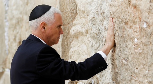 U.S. Vice President Mike Pence touches the Western Wall, Judaism's holiest prayer site, in Jerusalem's Old City.