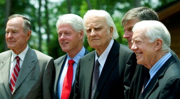 Former U.S. presidents, George H.W. Bush (L), Bill Clinton (2nd L) and Jimmy Carter (R), pose with evangelist Billy Graham and Franklin Graham (2nd R) before the Billy Graham Library Dedication on the campus of the Billy Graham Evangelistic Association in Charlotte, North Carolina.