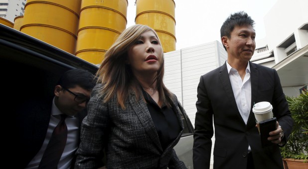 City Harvest Church founder Kong Hee (R) and his wife Sun Ho