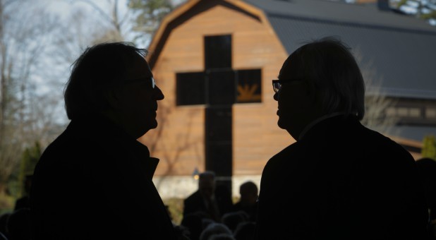 Mourners chat at the start of the funeral service for U.S. evangelist Billy Graham at the Billy Graham Library in Charlotte, North Carolina.