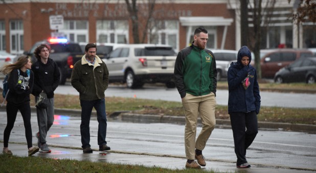 Frank Lanham (2nd R), a teacher at Great Mills High School leaves Leonardtown High School in Leonardtown, Maryland, U.S., March 20, 2018.