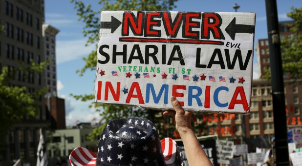 A protester holds a sign during an anti-Sharia rally in Seattle.