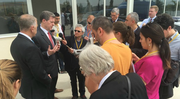 Ambassador Brownback talks to the press after Pastor Andrew Brunson’s hearing in Izmir, Turkey.